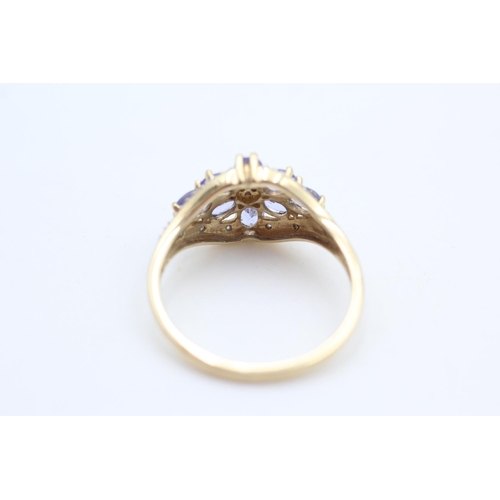 340 - 14ct gold iolite and diamond floral cluster ring size T