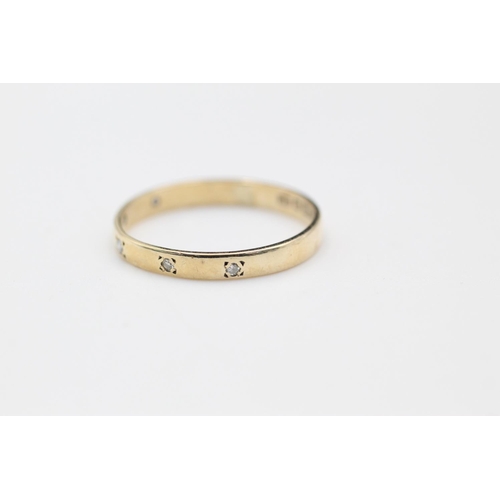 354 - 9ct gold diamond set band ring size P