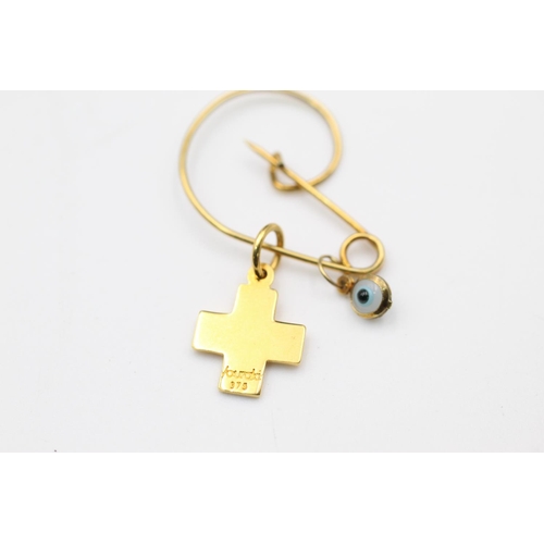 81 - 9ct pin with charms by Vounakis