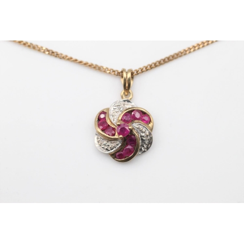 90 - 9ct Gold ruby & diamond swirl pendant necklace