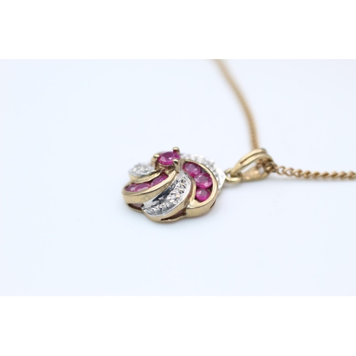 90 - 9ct Gold ruby & diamond swirl pendant necklace