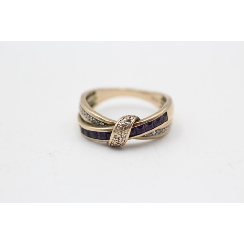 19 - 9ct gold & amethyst cross over ring (3g) Size M