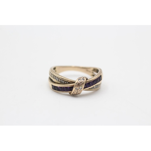 19 - 9ct gold & amethyst cross over ring (3g) Size M