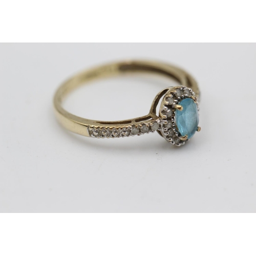 26 - 9ct gold topaz & diamond halo ring with diamond set shoulders (1.5g) Size M