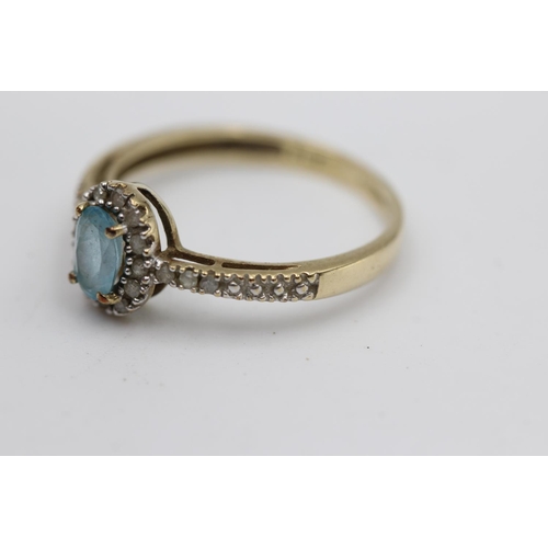 26 - 9ct gold topaz & diamond halo ring with diamond set shoulders (1.5g) Size M