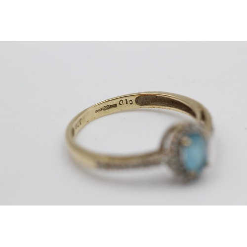 26 - 9ct gold topaz & diamond halo ring with diamond set shoulders (1.5g) Size M