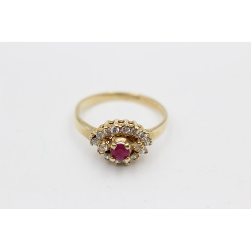 39 - 9ct gold ruby & clear gemstone fancy halo ring (2.8g) Size P