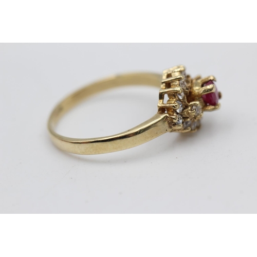 39 - 9ct gold ruby & clear gemstone fancy halo ring (2.8g) Size P