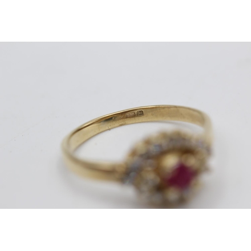 39 - 9ct gold ruby & clear gemstone fancy halo ring (2.8g) Size P
