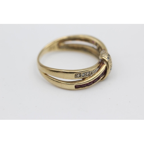 4 - 9ct gold diamond & ruby cross over ring (2.5g) Size L