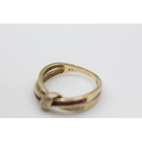 4 - 9ct gold diamond & ruby cross over ring (2.5g) Size L