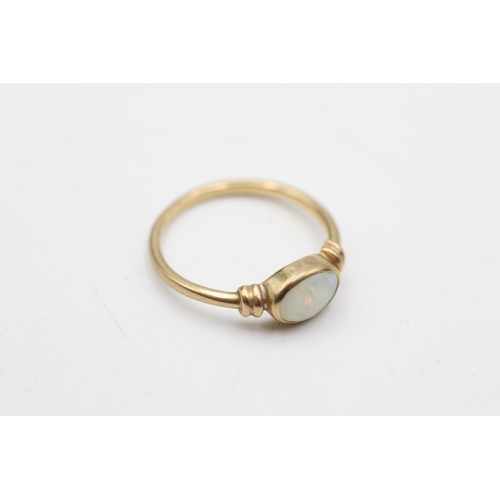 48 - 9ct gold opal ring with rub over setting. (1.4g) Size K