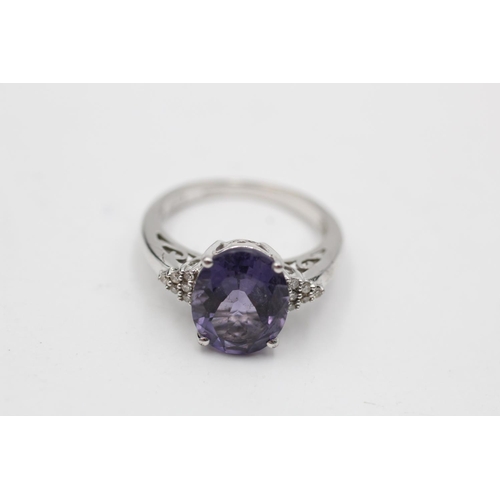 50 - 9ct white gold amethyst & diamond eleven stone dress ring (3.5g) Size M
