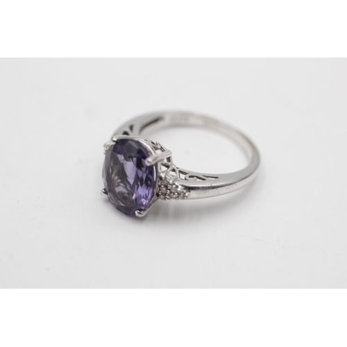 50 - 9ct white gold amethyst & diamond eleven stone dress ring (3.5g) Size M