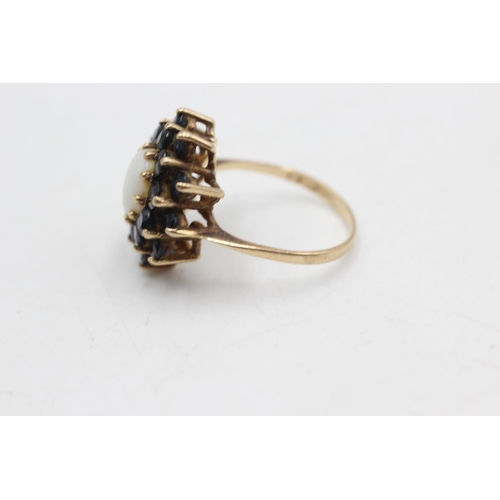 39 - 9ct gold vintage opal and sapphire halo ring (4.2g) size P