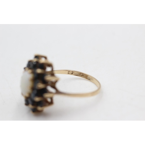 39 - 9ct gold vintage opal and sapphire halo ring (4.2g) size P