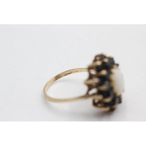 39 - 9ct gold vintage opal and sapphire halo ring (4.2g) size P