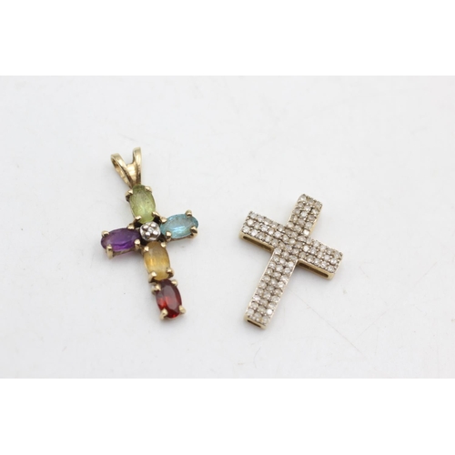 53 - 2 x 9ct gold cross pendants inc. Diamond, peridot, topaz, amethyst (2.2g)