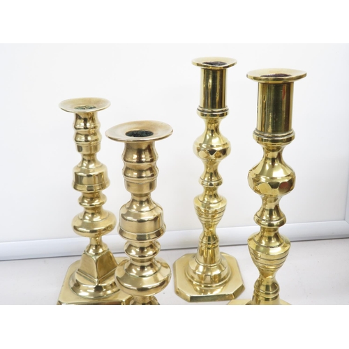 127 - 2x pairs early brass candlesticks 1x 10