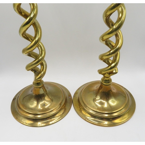 128 - Pair of spiral brass antique candlesticks 12