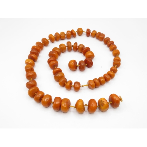 182 - Butterscotch amber tumbled bead necklace individually knotted 113g 30