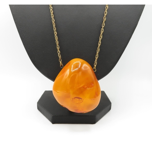 26 - Large lump of amber - butterscotch colour - on chain 39g