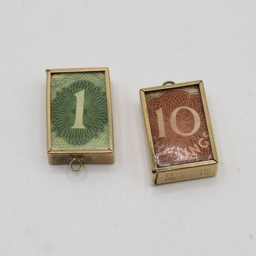 298 - 2x 9ct gold emergency money charms  5.7g