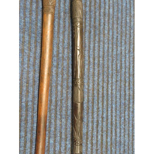 118 - 2x hardwood carved African walking sticks