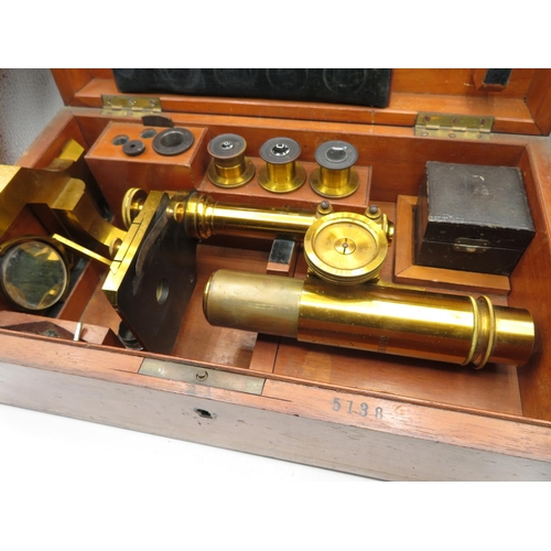 181 - Brass SEIBERT microscope with spare lenses in wooden box