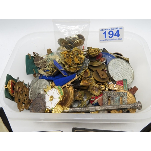 194 - Box containing military buttons, badges and medals