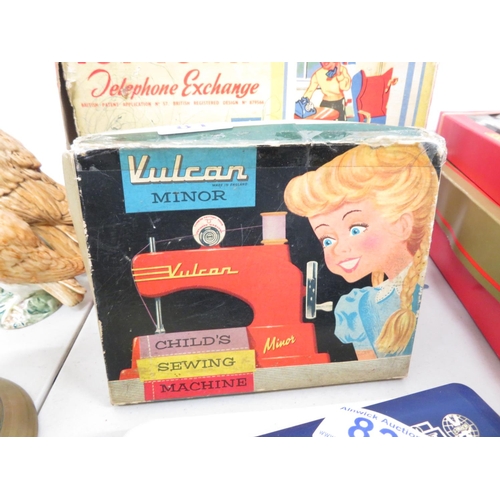 81 - Vulcan Minor boxed sewing machine and Toy Town telephone exchange boxed