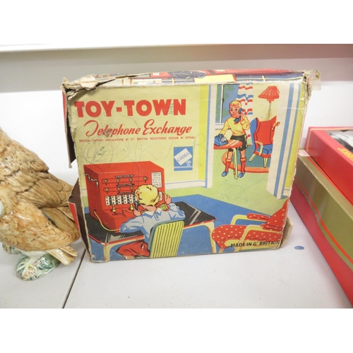 81 - Vulcan Minor boxed sewing machine and Toy Town telephone exchange boxed