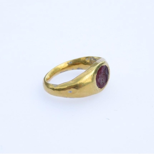 6 - Roman gold ring child's size with engraved Intaglio probably garnet 1.7g