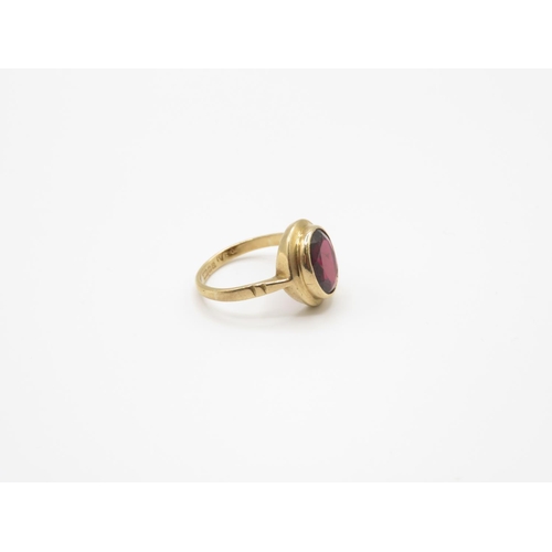 109 - 9ct gold and garnet ring size J 2.5g