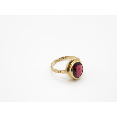 109 - 9ct gold and garnet ring size J 2.5g