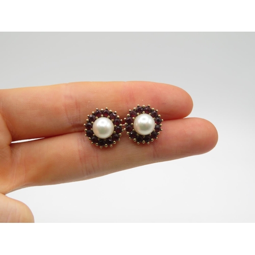 148 - Pair of 9ct pearl and garnet earrings  4.2g
