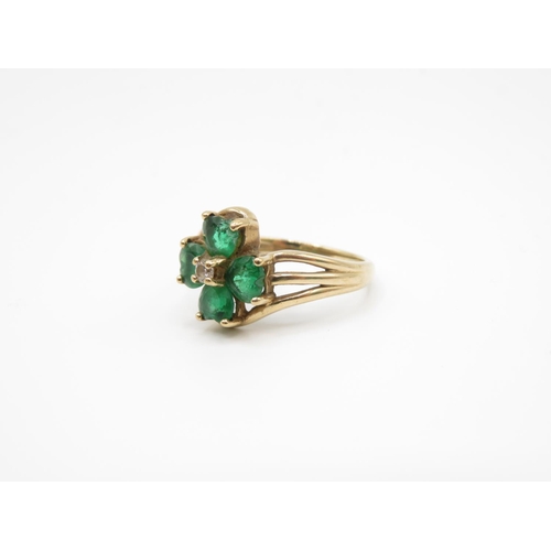 157 - 9ct gold ring with green stones size P  3.6g