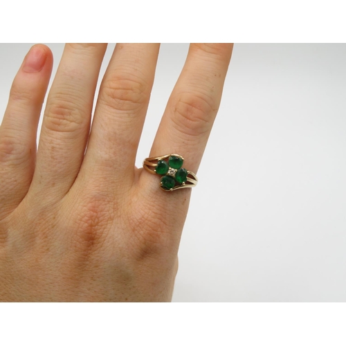 157 - 9ct gold ring with green stones size P  3.6g