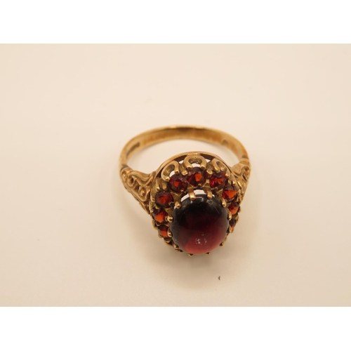 69 - 9ct gold and garnet ring size P  4.4g