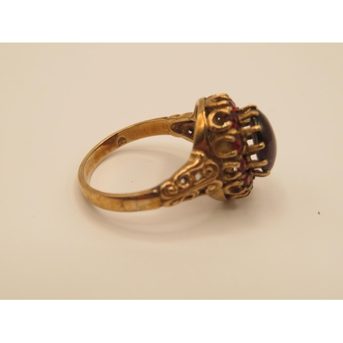 69 - 9ct gold and garnet ring size P  4.4g