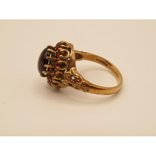 69 - 9ct gold and garnet ring size P  4.4g