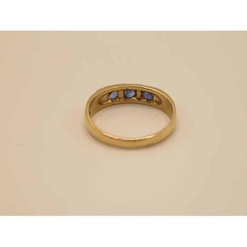 78 - 9ct gold gypsy set sapphire ring size O  2.6g
