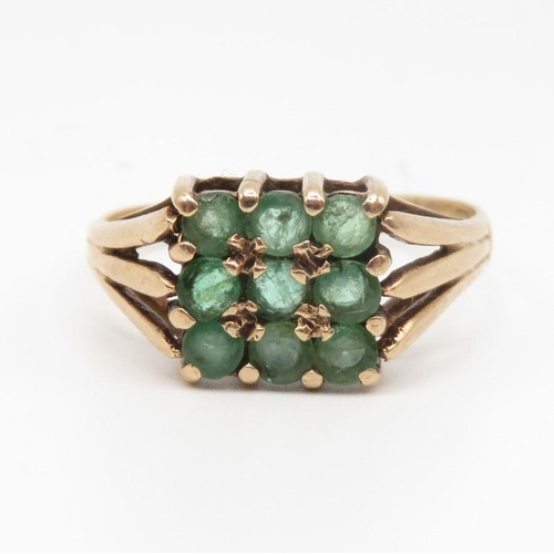 91 - 9ct gold ring with green stones size N  2.6g