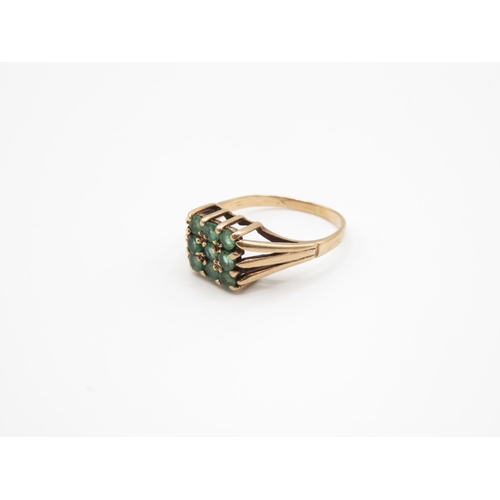 91 - 9ct gold ring with green stones size N  2.6g