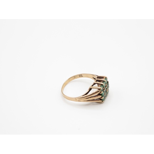 91 - 9ct gold ring with green stones size N  2.6g