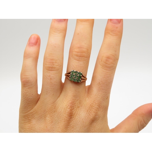 91 - 9ct gold ring with green stones size N  2.6g