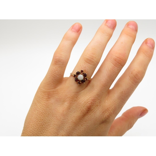 97 - 9ct gold garnet and opal ring size L  2.2g