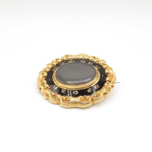 10 - 18ct front and 9ct back Memorium brooch with woven hair and black enamel with original leather fitte... 