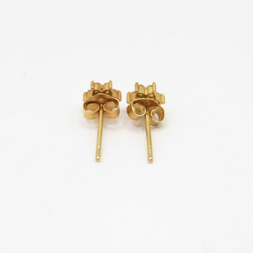 2 - Pair of 18ct gold and diamond earrings  .9g