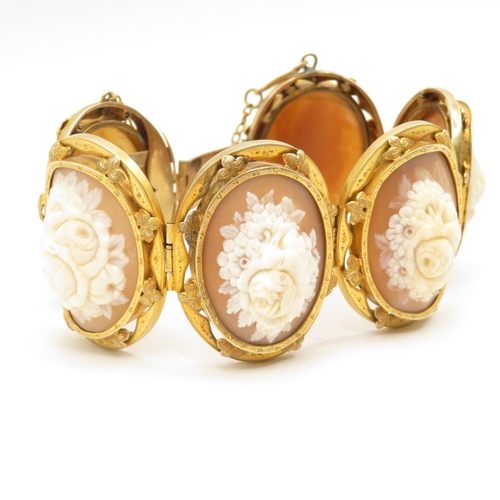 22 - 14ct gold bracelet with carved shell cameo inserts each panel measuring 40mm long x 30mm wide  total... 